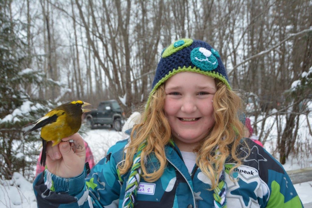 Kids counting birds as part of the Christmas bird count event.